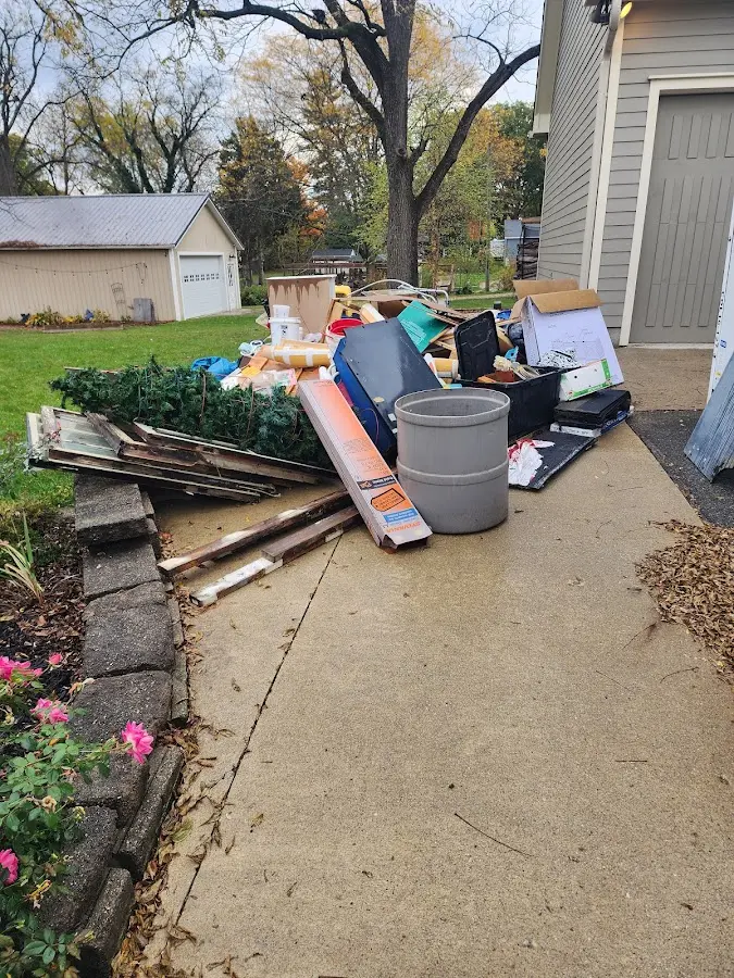 Dumpster being loaded with debris for 30 Yard Dumpster Rental in Verde Village